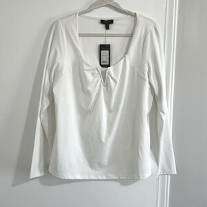 Long sleeve white top with U front.